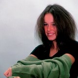 The sweater's electric charge is the opposite of our hair's when dressing The sweater's electric charge is the opposite of our hair's when dressing