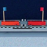 Pushing away two cars of equal mass with a spring